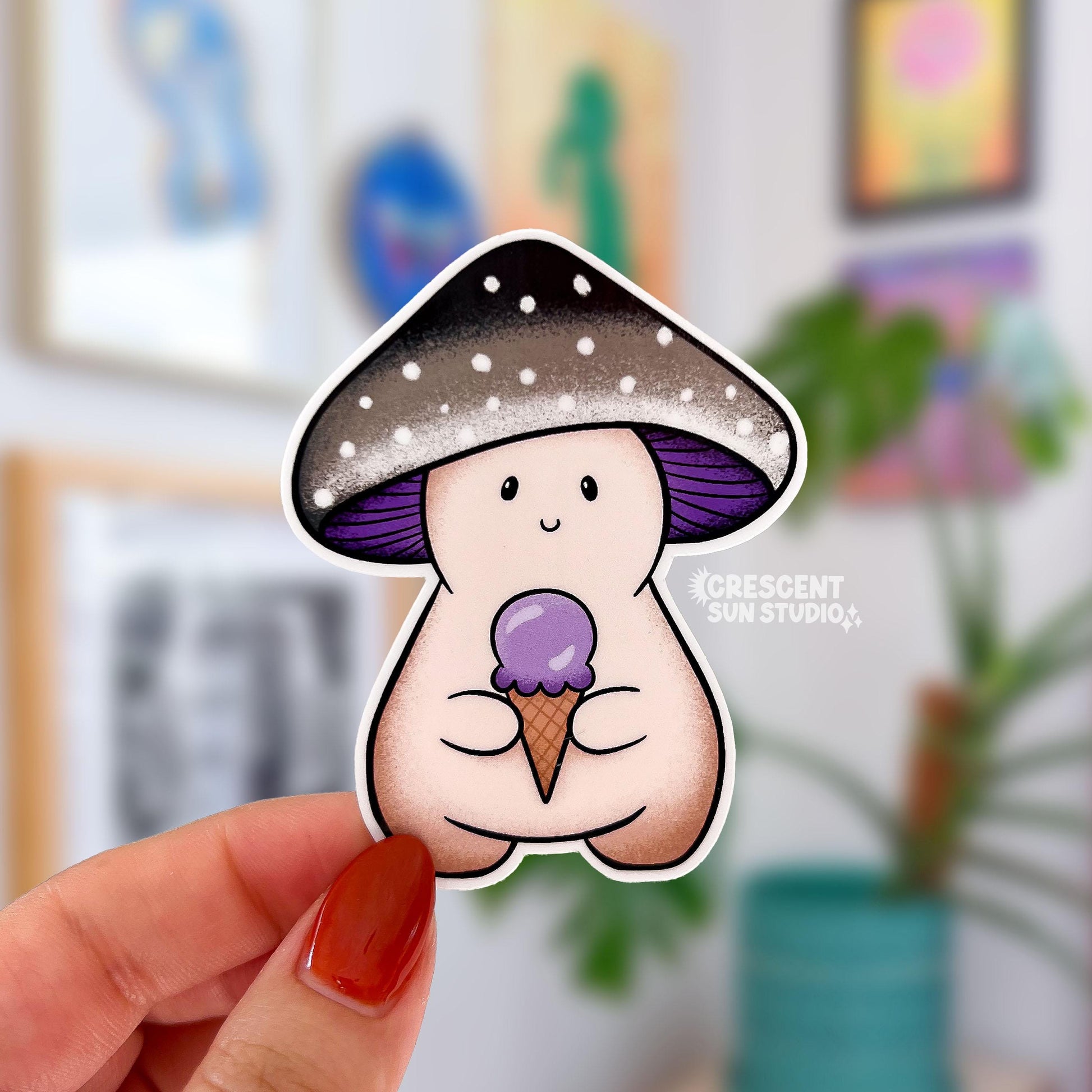 A mushroom character sticker whose cap is shades of black and grey with a purple underside. The mushroom holds a purple ice cream cone.