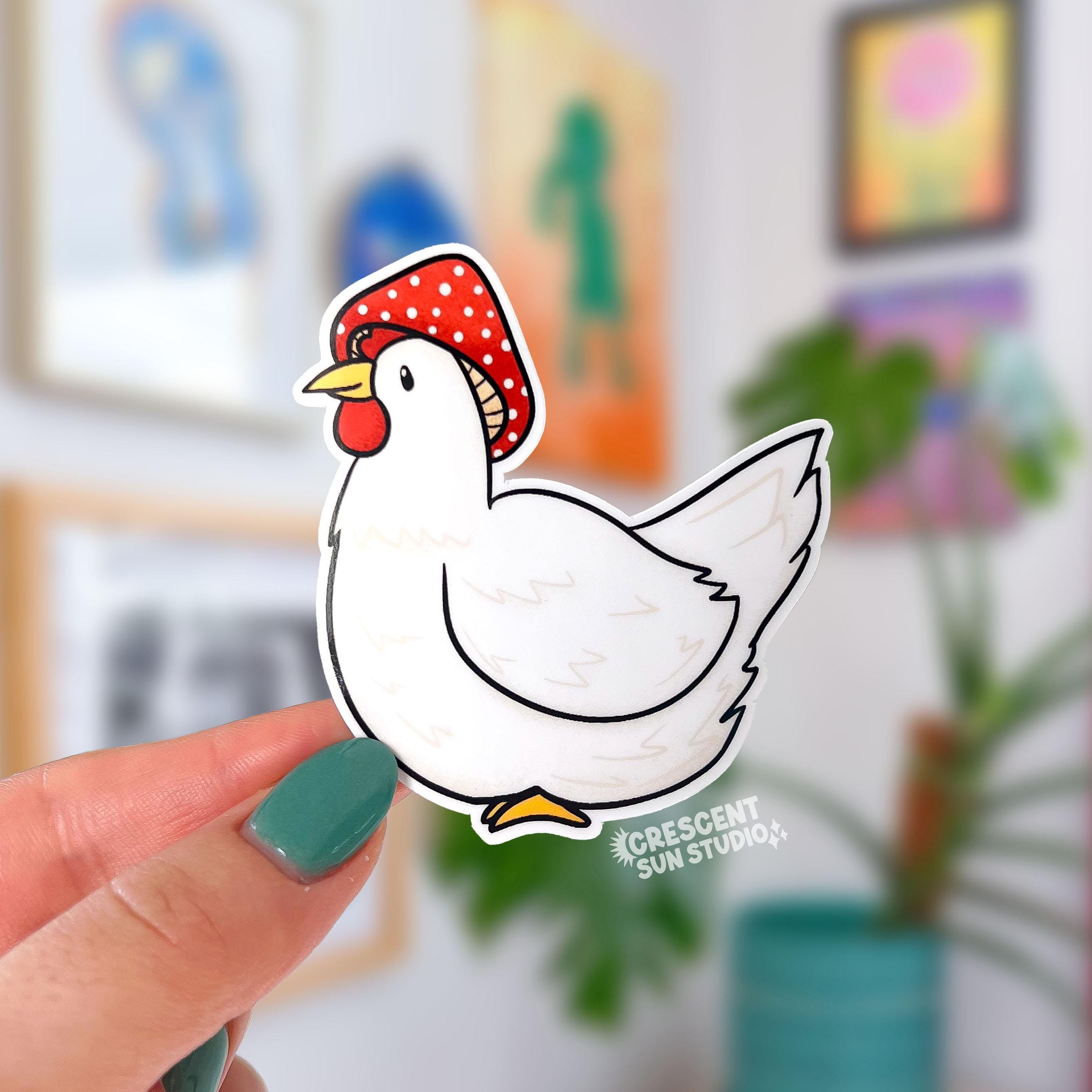 A die cut sticker of a white chicken wearing a red and white mushroom cap. 