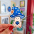 A sticker in the shape of a wizard mushroom character. The mushroom cap is blue with white stars and spirals. The magician holds a 20-sided die, used in tabletop games, and has rolled a 1.