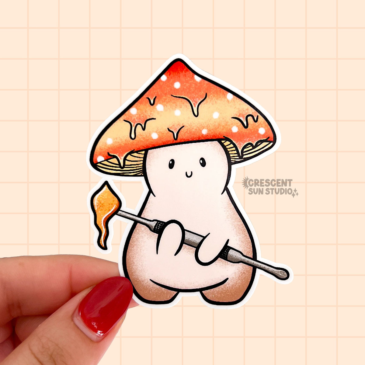 This cute sticker portrays a little orange capped mushroom character holding a dab tool with a glob of wax concentrate on it.