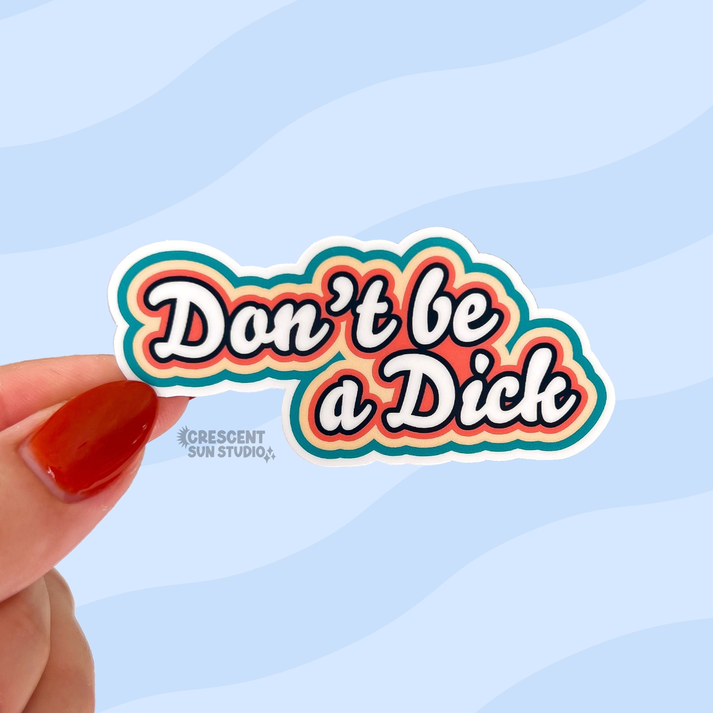 die cut sticker of "don't be a dick" in white script text surrounded by outlines of orange, yellow and teal.