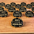 A group of cloud-shaped black pins with gold lettering that reads "don't fucking touch me" surrounded by little stars.