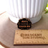 The pin sits above a wooden ruler, showing its size of 1.35 inches