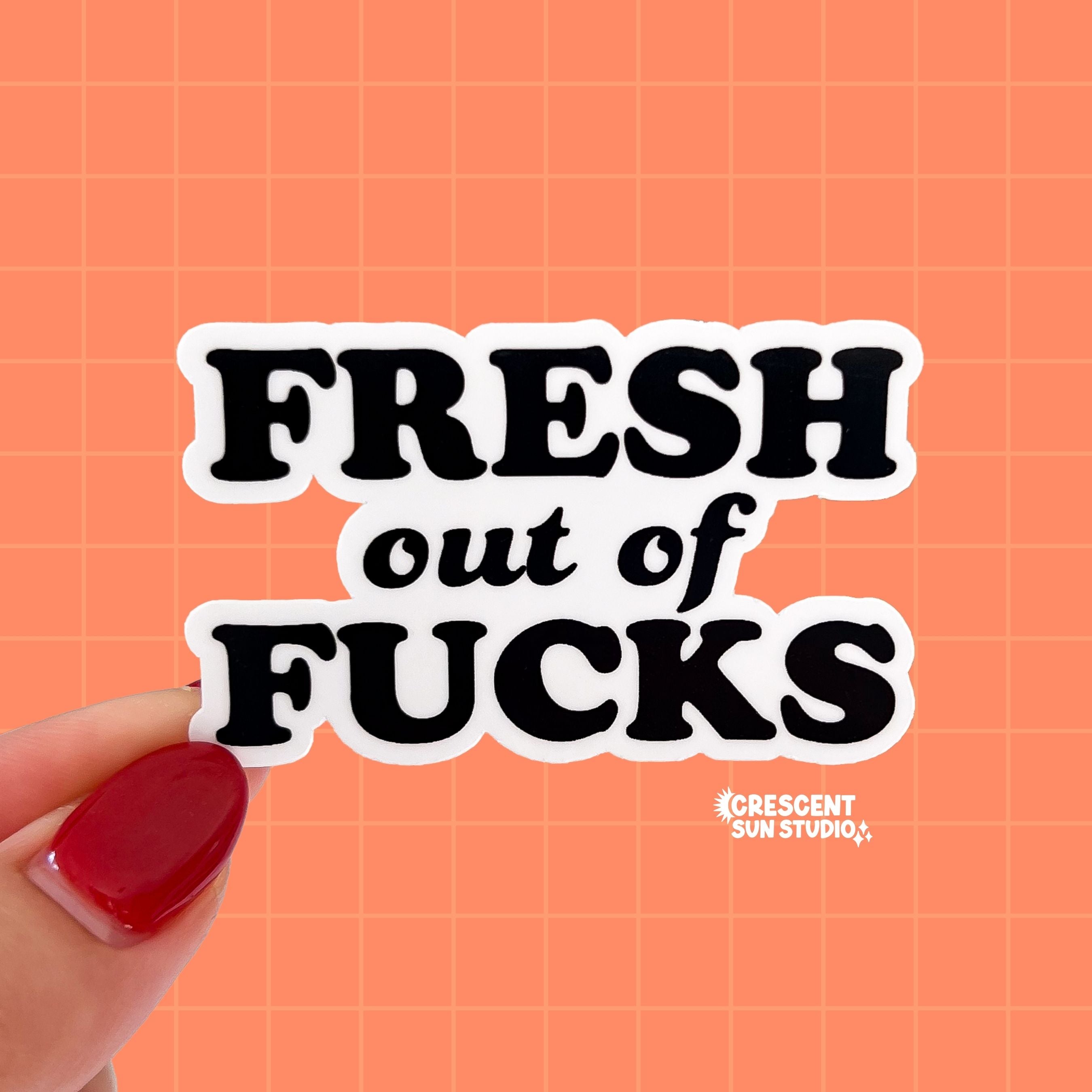 A diecut sticker with black text that reads "fresh out of fucks"