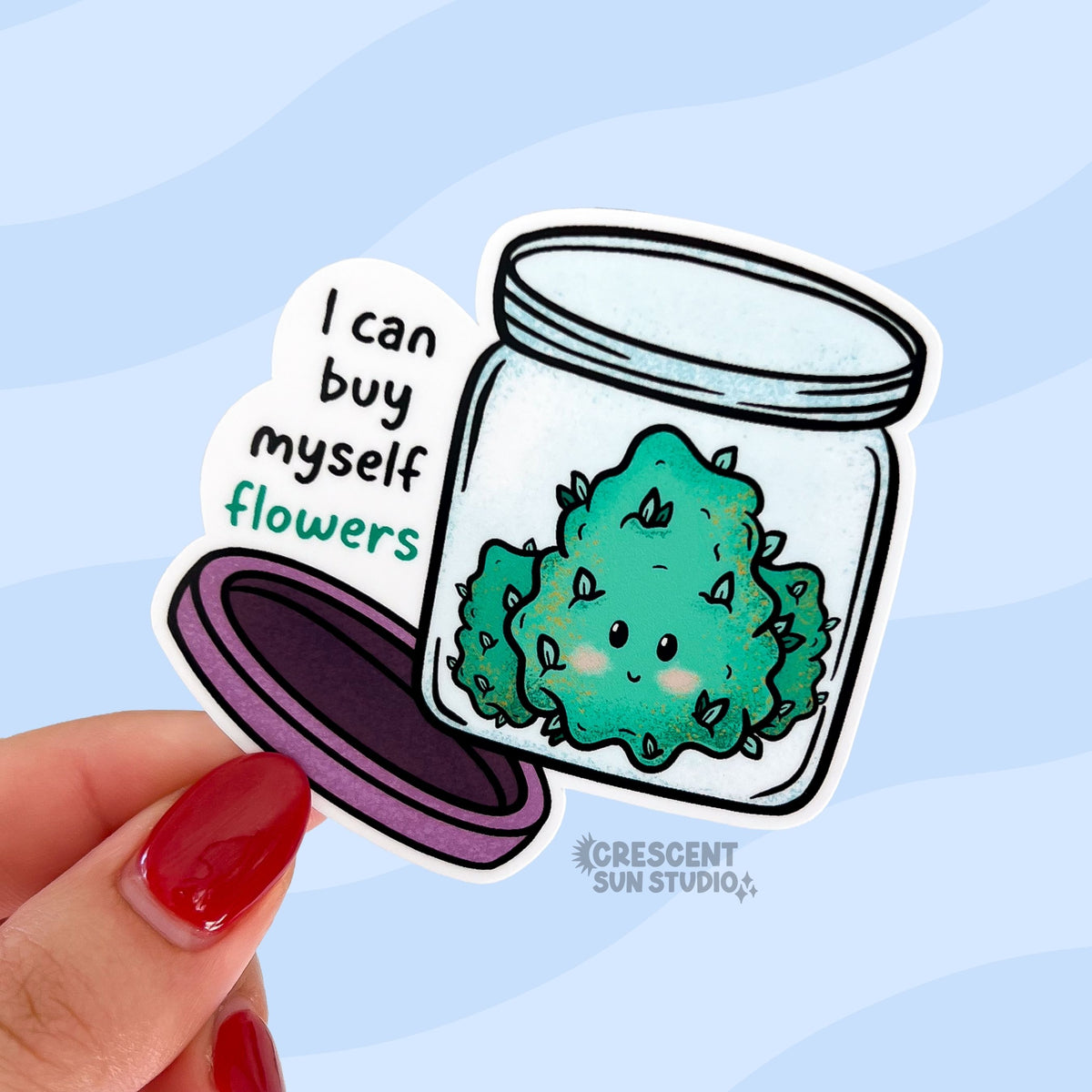 Die-cut sticker of a smiling cannabis nug in an open glass jar with a purple lid, with the text 'I can buy myself flowers' in black and teal lettering.