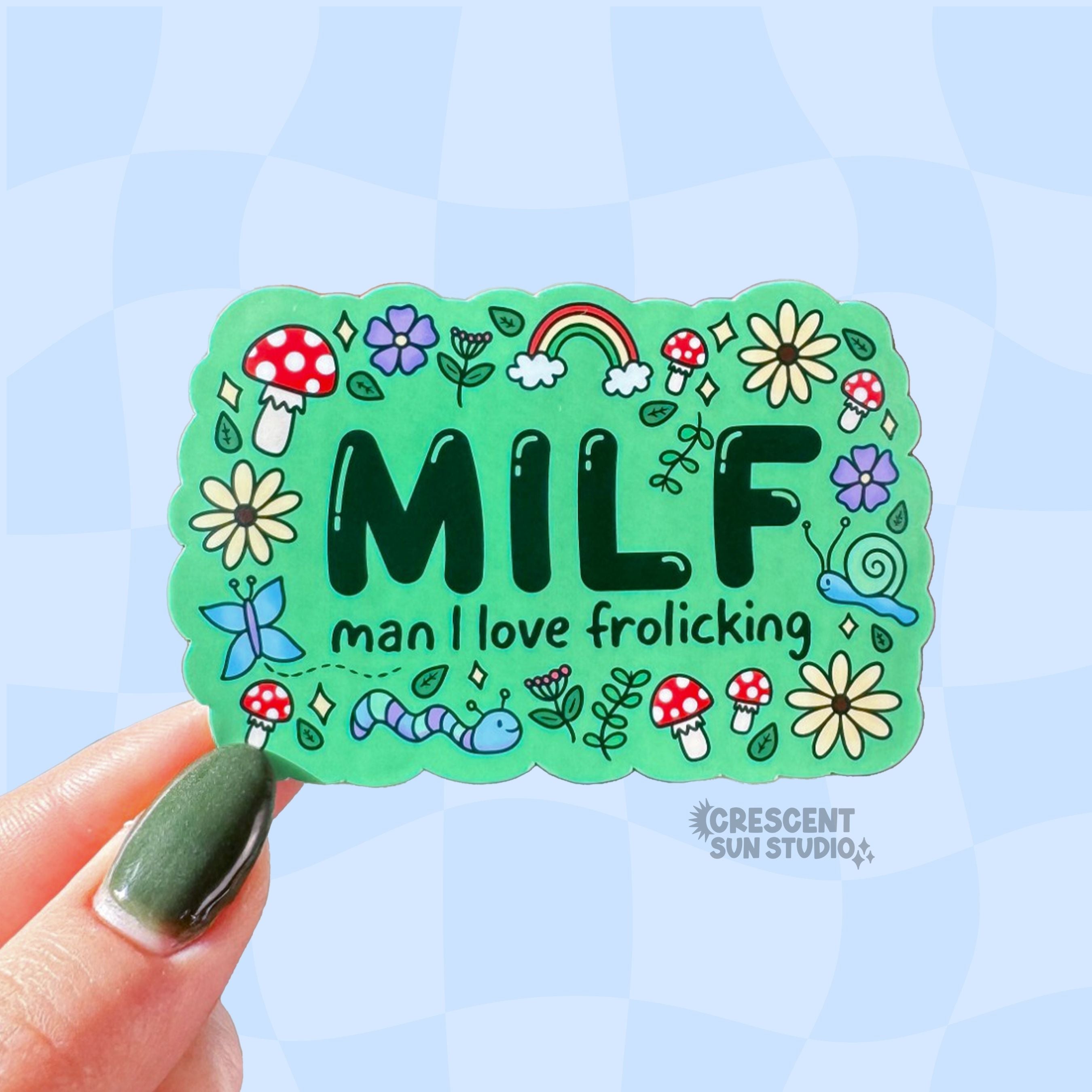 Colorful rectangle-shaped sticker with 'MILF man I love frolicking' text surrounded by doodles of mushrooms, critters, flowers and leaves.