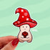 This sticker is shaped like a happy mushroom character whose cap is shaped like a red wizard's hat holds a d20 die. He rolled a nat 20.