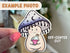 Image shows a mushroom character sticker with an off-center cut as its flaw.