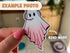 Image shows a die cut ghost sticker with a bend mark as a flaw.