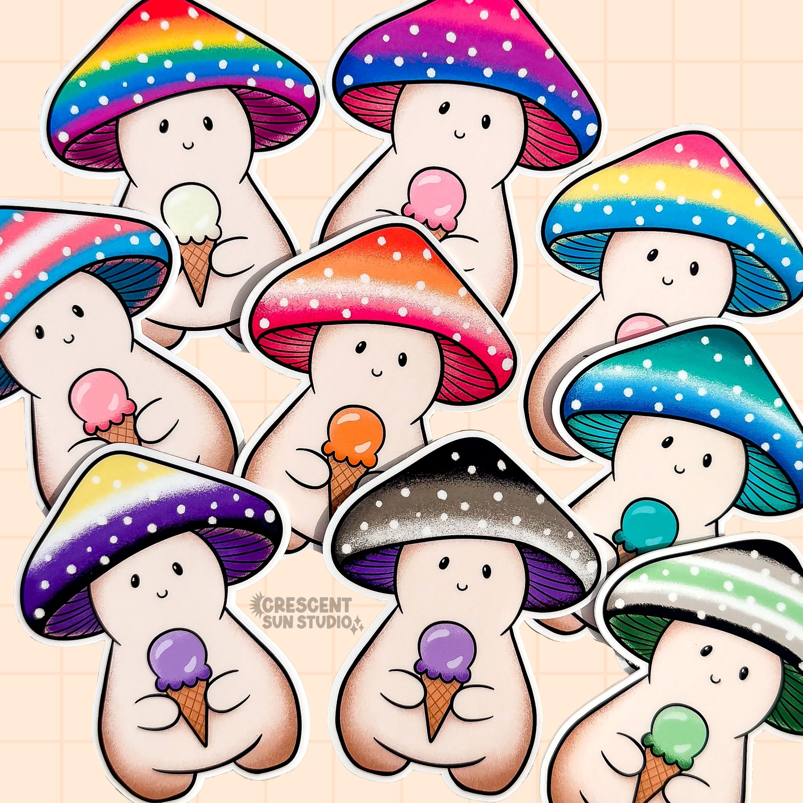 Colorful mushroom character stickers scattered on a beige surface. The caps of each mushroom depict the colors of different pride flags, and each mushroom character holds an ice cream cone with an ice cream scoop that matches a color on the mushroom caps.