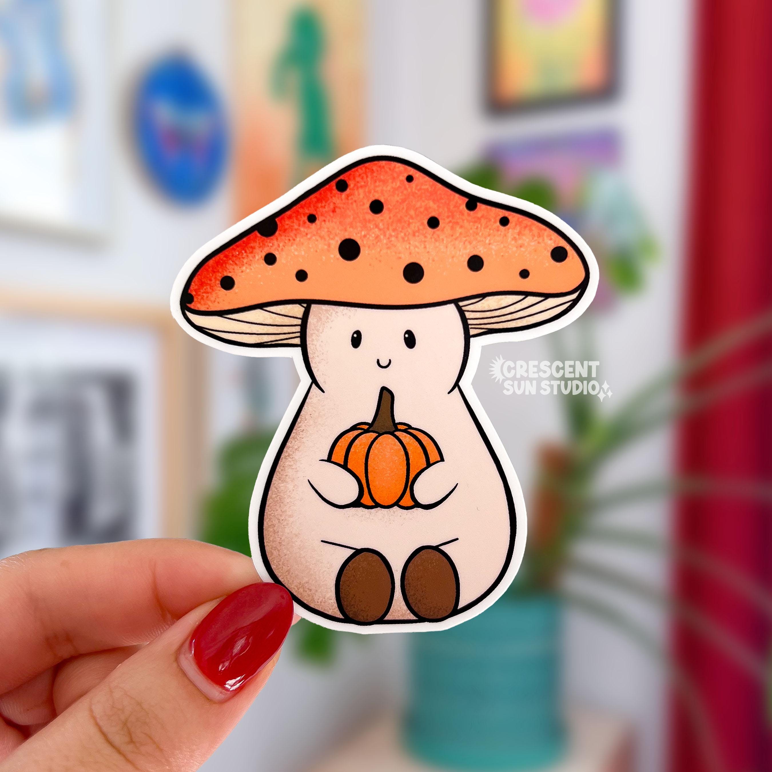 A mushroom shaped sticker of a friendly character wearing an orange mushroom cap and holding a small orange pumpkin
